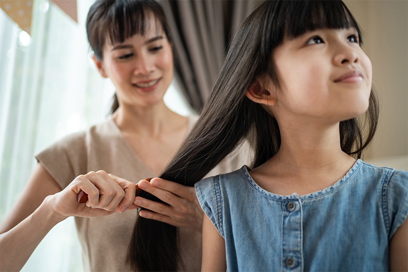 mother-combing-her-child